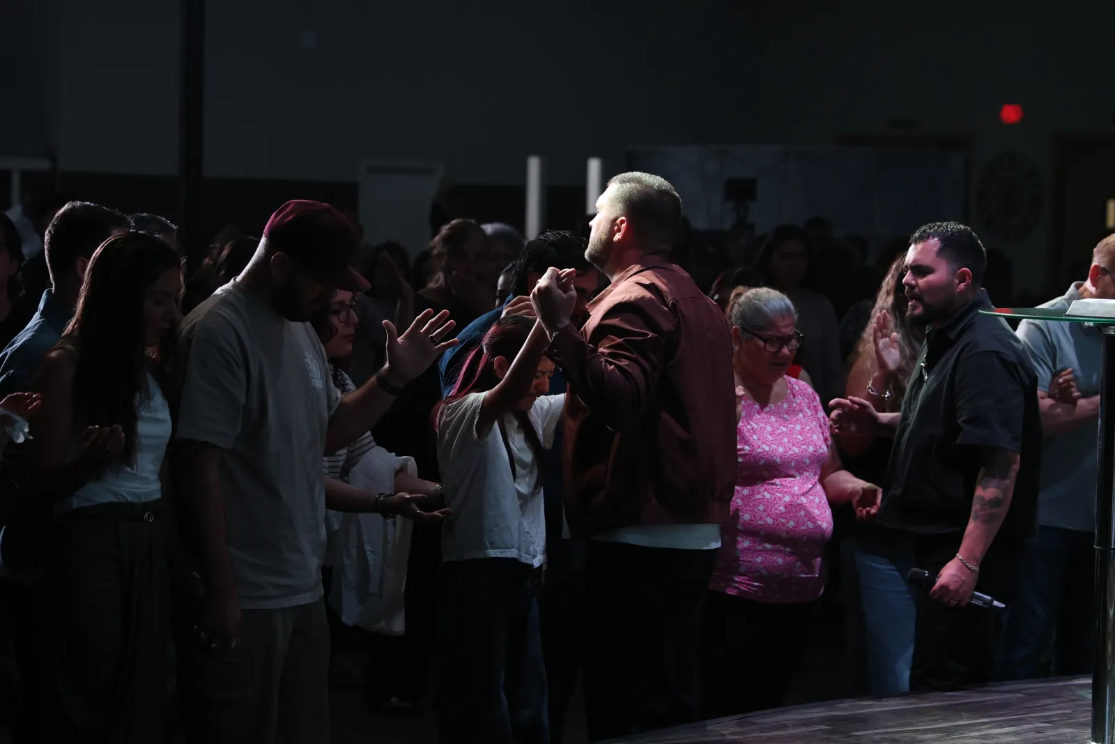 People praying together at Nuevo Pacto Church